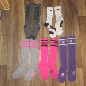 Pink and one nike pair of high socks